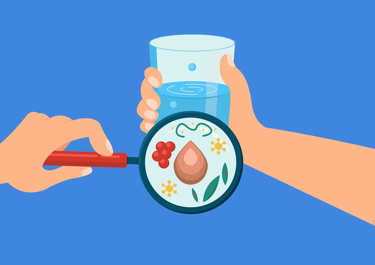 Cartoon illustration of hands holding a magnifying glass over a glass of water, showing microorganisms, germs, and particles inside the glass.